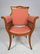 Edwardian inlaid throne style armchair with ribbon and flower motif to back of chair.