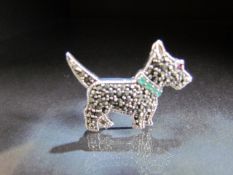 Silver brooch in the form of a scottie dog