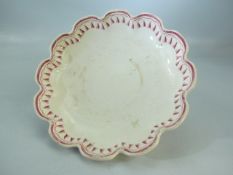 19th century creamware bowl of floral form. The surround of the bowl decorated with pink floral