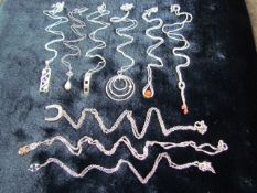 Selection of hallmarked silver pendants and chains