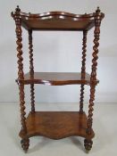 Walnut three tier WhatNot. Late Victorian c 1870, Serpentine fronted with carved gallery and