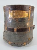 Indian metal bound scrap grain bucket with hammered writing to front.