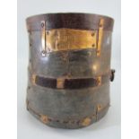 Indian metal bound scrap grain bucket with hammered writing to front.