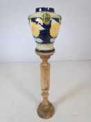 Coloured pottery jardiniere on turned wooden stand
