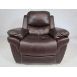 Brown leather electric recliner chair (paper and remote in office)