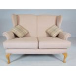 Parker Knoll style newly upholstered two seater settee on cabriole feet