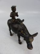 Bronze Buffalo with piper seated on its back possibly oriental/Chinese