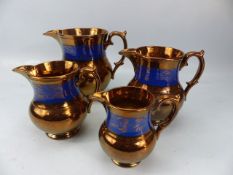 Graduated set of Victorian Copper Lustre jugs