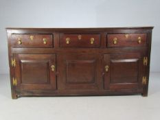 19th Century long oak Sideboard. Simplistic features of three drawers over three cupboards. Each