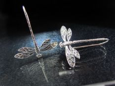 Silver pair of earrings in the form of dragonfly drop earrings