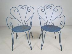 French pair of metal bistro chairs