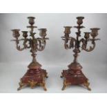 French pair of Rococo style candleabras on marble stepped base and ormolu feet. Five armed cast