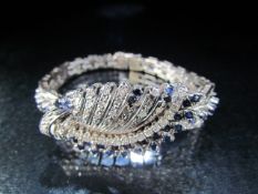18ct Art Deco Sapphire and Diamond bangle. Approx weight 28.8g