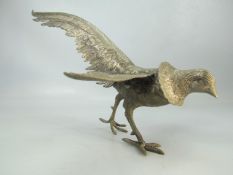 Silver coloured figure of an ornamental cock pheasant