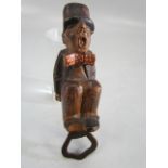 Vintage bottle opener with wooden carving of a gentleman with bow tie & top hat