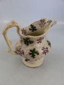 Early Staffordshire transfer ware jug - marked 'Grotto' to base. Decorated in Greens and Purples