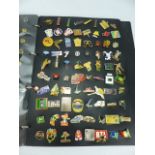 Album containing over 200 approx lapel badges