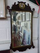 Antique mahogany mirror with central pierced work top (Gilded) surrounding a bevel mirror