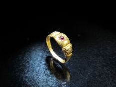 15ct Gypsy style gold ring set with ruby and two diamond studs. 1.2g A/F