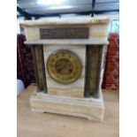 Architectural marble mantle clock with brass repousse plaque and columns