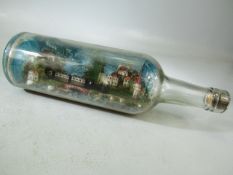 Vintage bottle with scene inside - depicting a swiss village
