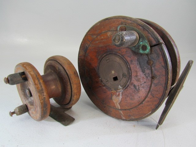 Two vintage wooden fishing reels