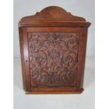 Oak hanging corner cupboard with carved front