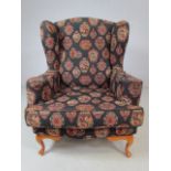 Antique style royal blue upholstered wing back fireside armchair