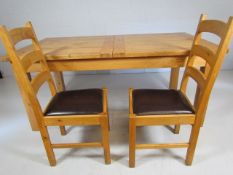 Oak dining table and two chairs