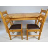 Oak dining table and two chairs