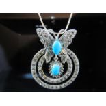 Silver pendant necklace of butterfly form set with Turquoise