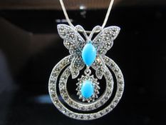 Silver pendant necklace of butterfly form set with Turquoise