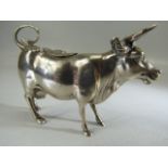 Silver Continental hallmarked 'Cow' creamer. Marked 800 to belly. The hinged lid with floral motif