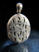 Silver coloured pendant/locket