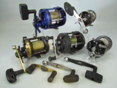 Five fishing reels - Shakespeare Xcede, Okuma Classic Pro XT, Abu Garcia Seven, Akios S-Line