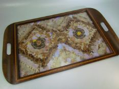 Edwardian inlaid serving tray with butterfly wing design under glass.