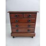 Antique mahogany Apprentice set of drawers with hidden drawer to bottom.