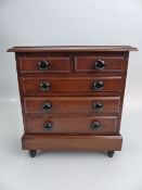 Antique mahogany Apprentice set of drawers with hidden drawer to bottom.