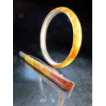 Butterscotch Amber and silver contemporary jewellery consisting of a a brooch and a bangle marked