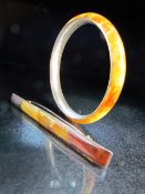 Butterscotch Amber and silver contemporary jewellery consisting of a a brooch and a bangle marked