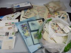 Large selection of stamps and first day covers in presentation packs.