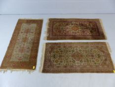 Three beige ground woollen carpets