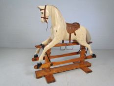 Antique Cremello style coloured rocking horse on antique wooden base