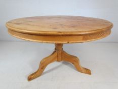 Large pine circular dining table on pedestal base