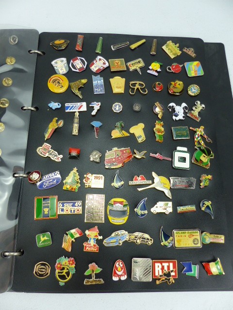 Album containing over 200 approx lapel badges