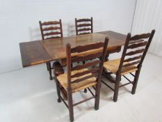 Antique oak dining table with matching rush seated chairs