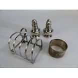 Silver hallmarked items to include salt & pepper shakers a silver hallmarked toast rack & a silver