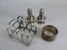 Silver hallmarked items to include salt & pepper shakers a silver hallmarked toast rack & a silver