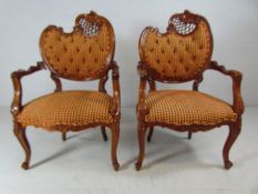 Oriental style pair of chairs with Rococo scroll tops decorated with Acanthus leaves and fretwork.