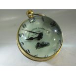 Hanging ball clock with brass surround and glass magnified face